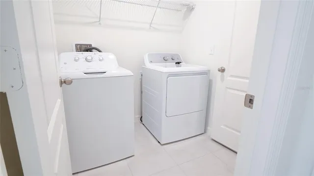 a utility room with dryer and washer