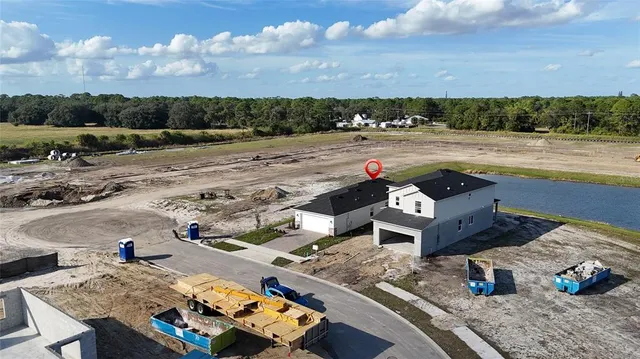 an aerial view of a house with outdoor space