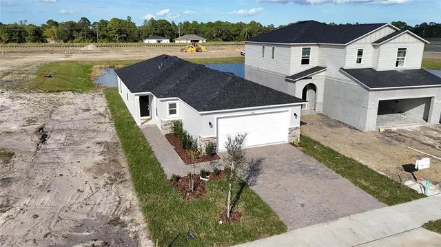 a aerial view of a house with a yard