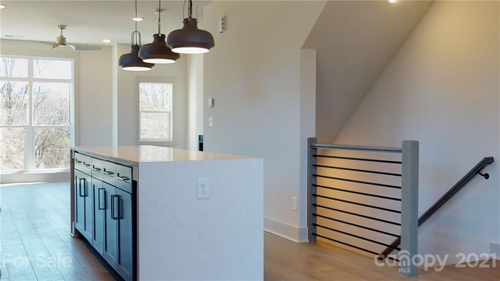 2335 Wesley Village Road, Unit 34 Charlotte, NC 28208 - Photo 12 of 40 a view of a hallway with windows