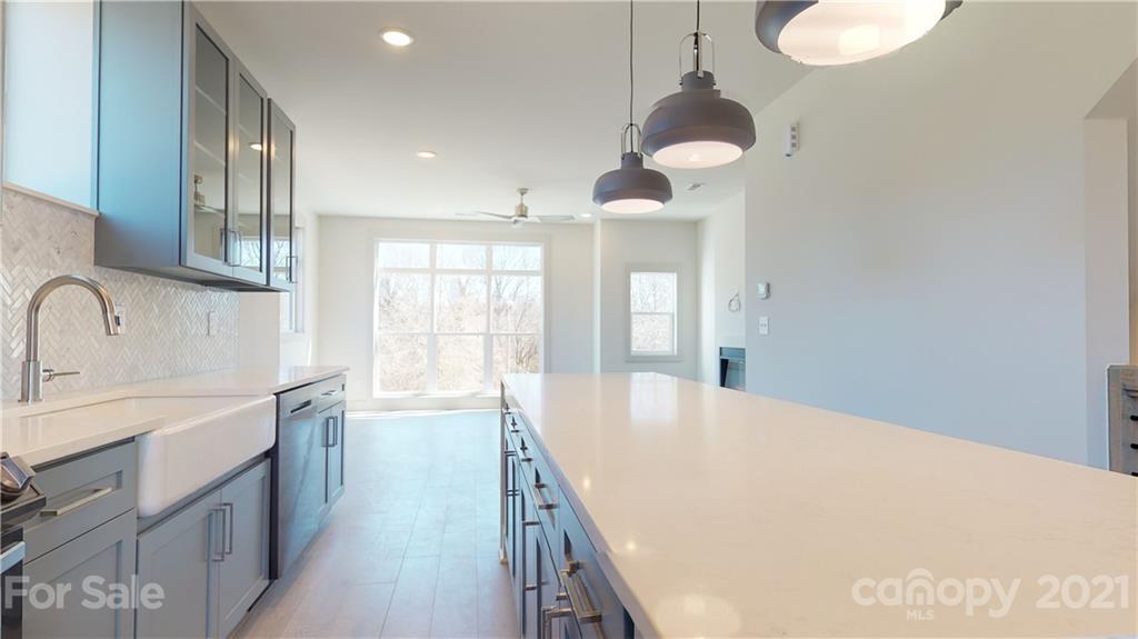 2335 Wesley Village Road, Unit 34 Charlotte, NC 28208 - Photo 13 of 40 a large white kitchen with a large window