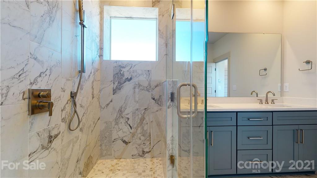 2335 Wesley Village Road, Unit 34 Charlotte, NC 28208 - Photo 19 of 40 a bathroom with a sink and a mirror