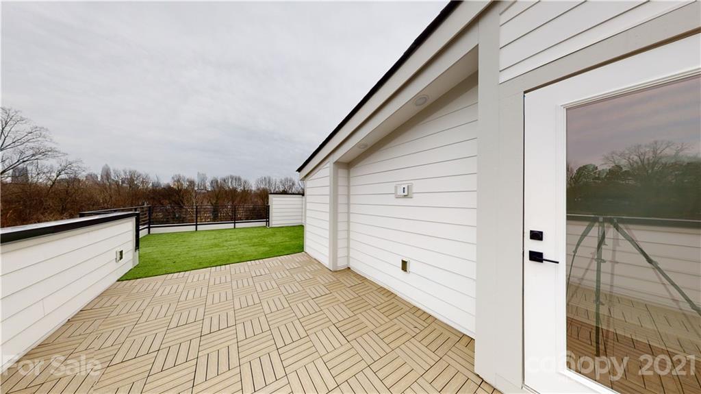 2335 Wesley Village Road, Unit 34 Charlotte, NC 28208 - Photo 23 of 40 a view of a back yard of the house