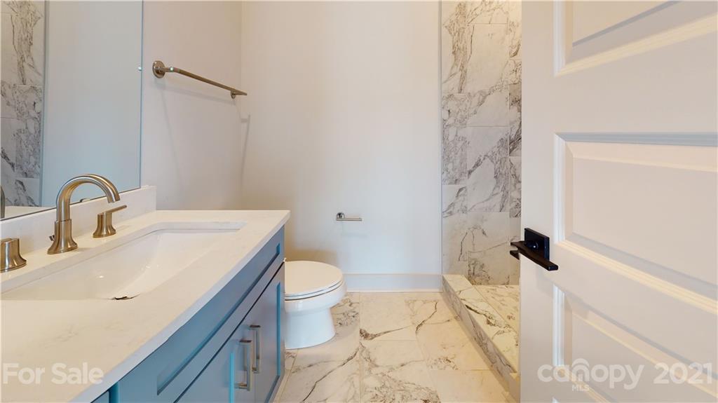 2335 Wesley Village Road, Unit 34 Charlotte, NC 28208 - Photo 29 of 40 a bathroom with a sink toilet and shower