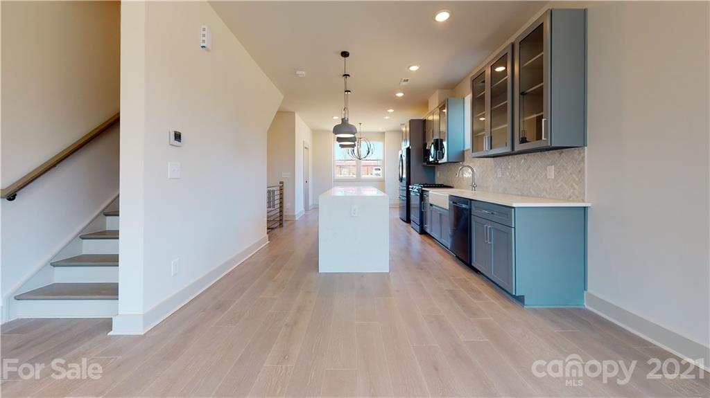 2335 Wesley Village Road, Unit 34 Charlotte, NC 28208 - Photo 30 of 40 a view of a kitchen with a sink and a refrigerator