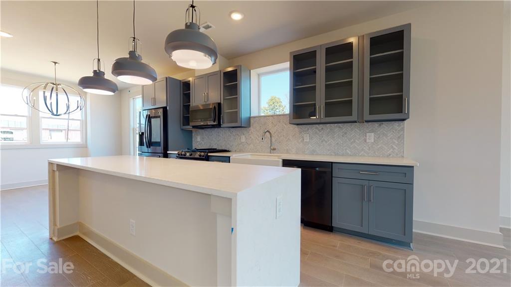 2335 Wesley Village Road, Unit 34 Charlotte, NC 28208 - Photo 4 of 40 a kitchen with cabinets and window