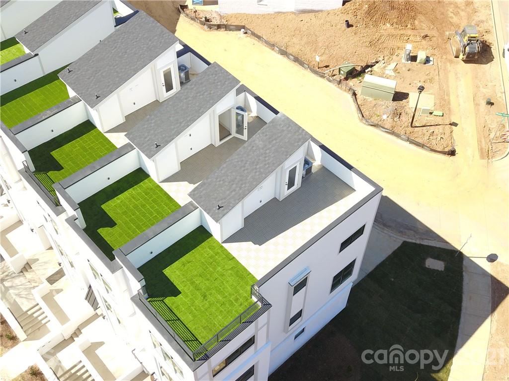 2335 Wesley Village Road, Unit 34 Charlotte, NC 28208 - Photo 35 of 40 a view of a house with a garden