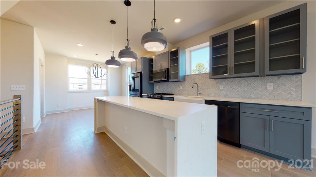 2335 Wesley Village Road, Unit 34 Charlotte, NC 28208 - Photo 8 of 40 a kitchen with a stove and a microwave