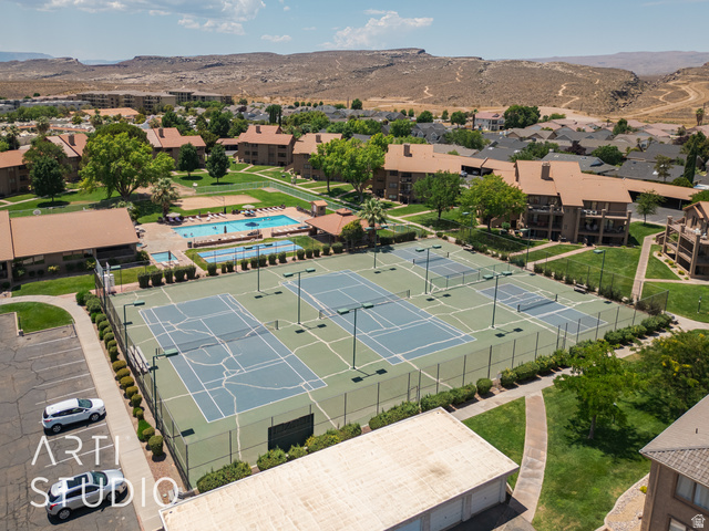 860 South Village Road, Unit A6 St. George, UT 84770 - Photo 33 of 41 Drone / aerial view of a mountainous background and a pool