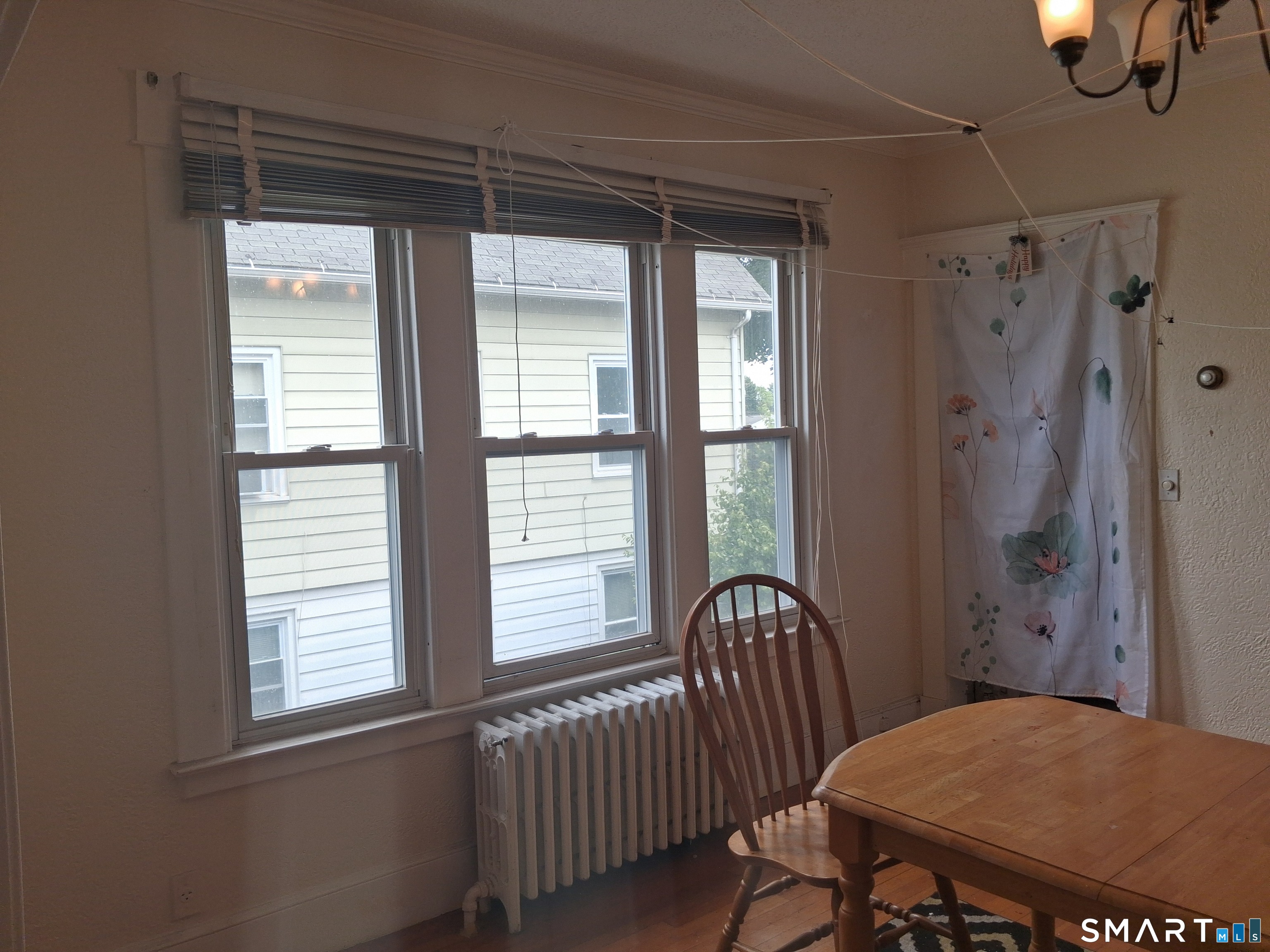 26 4th Street Hamden, CT 06514 - Photo 38 of 40 a view of a room with window and wooden floor