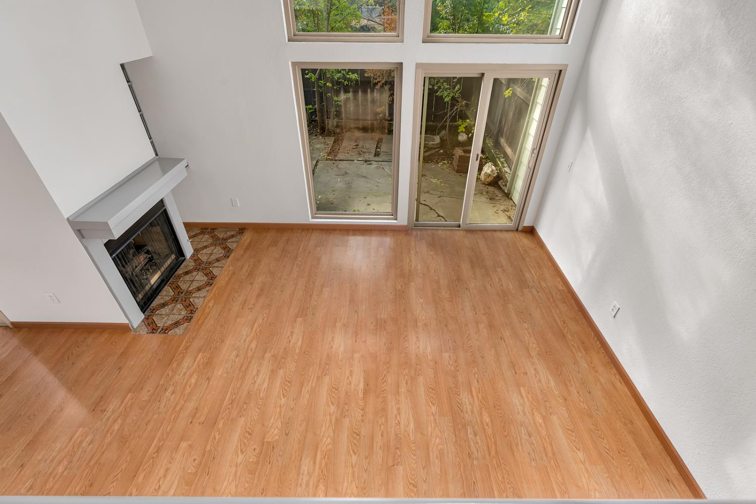 3350 M Street, Unit 74 Merced, CA 95348 - Photo 13 of 53 a view of a hallway with wooden floor and a fireplace