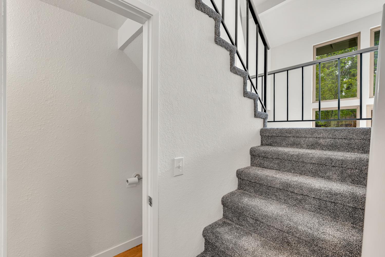 3350 M Street, Unit 74 Merced, CA 95348 - Photo 14 of 53 a view of staircase with lots of frames on wall