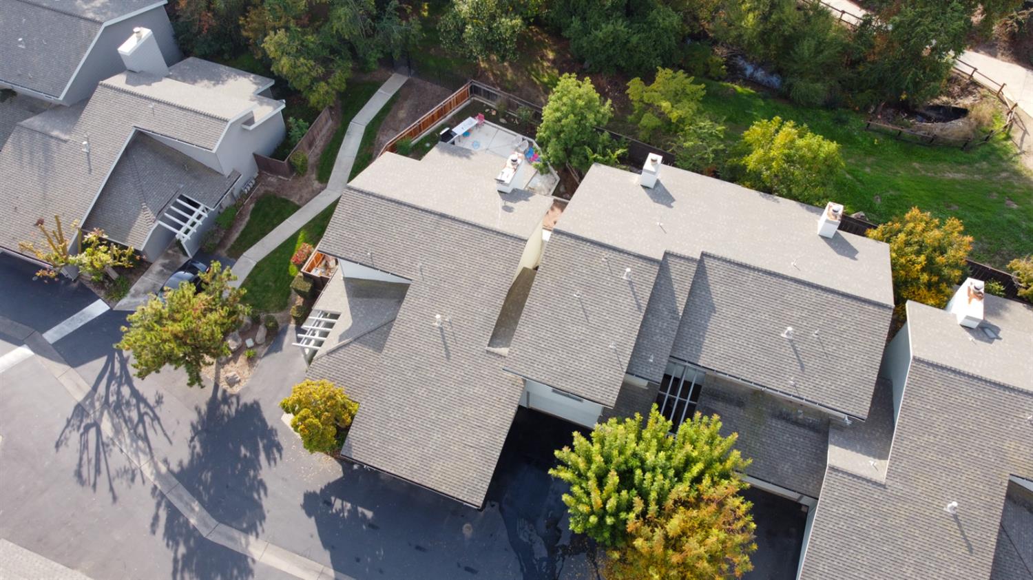 3350 M Street, Unit 74 Merced, CA 95348 - Photo 46 of 53 an aerial view of a house with a garden and swimming pool
