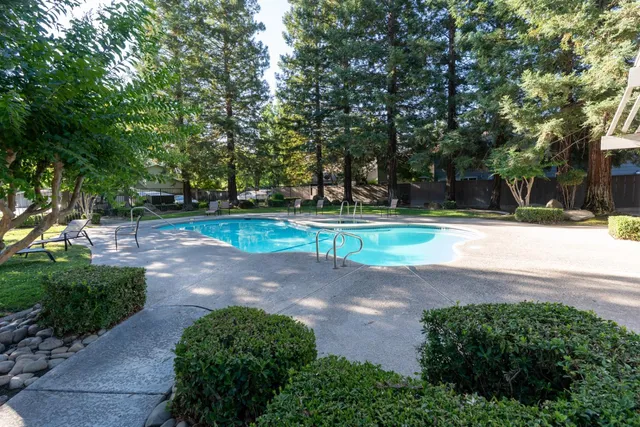 a view of a swimming pool with a sitting area