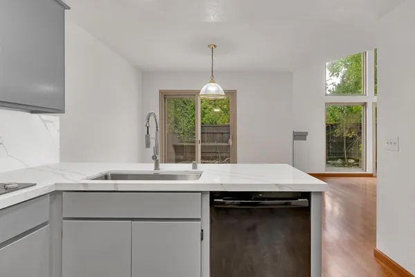 a kitchen with a sink and a window