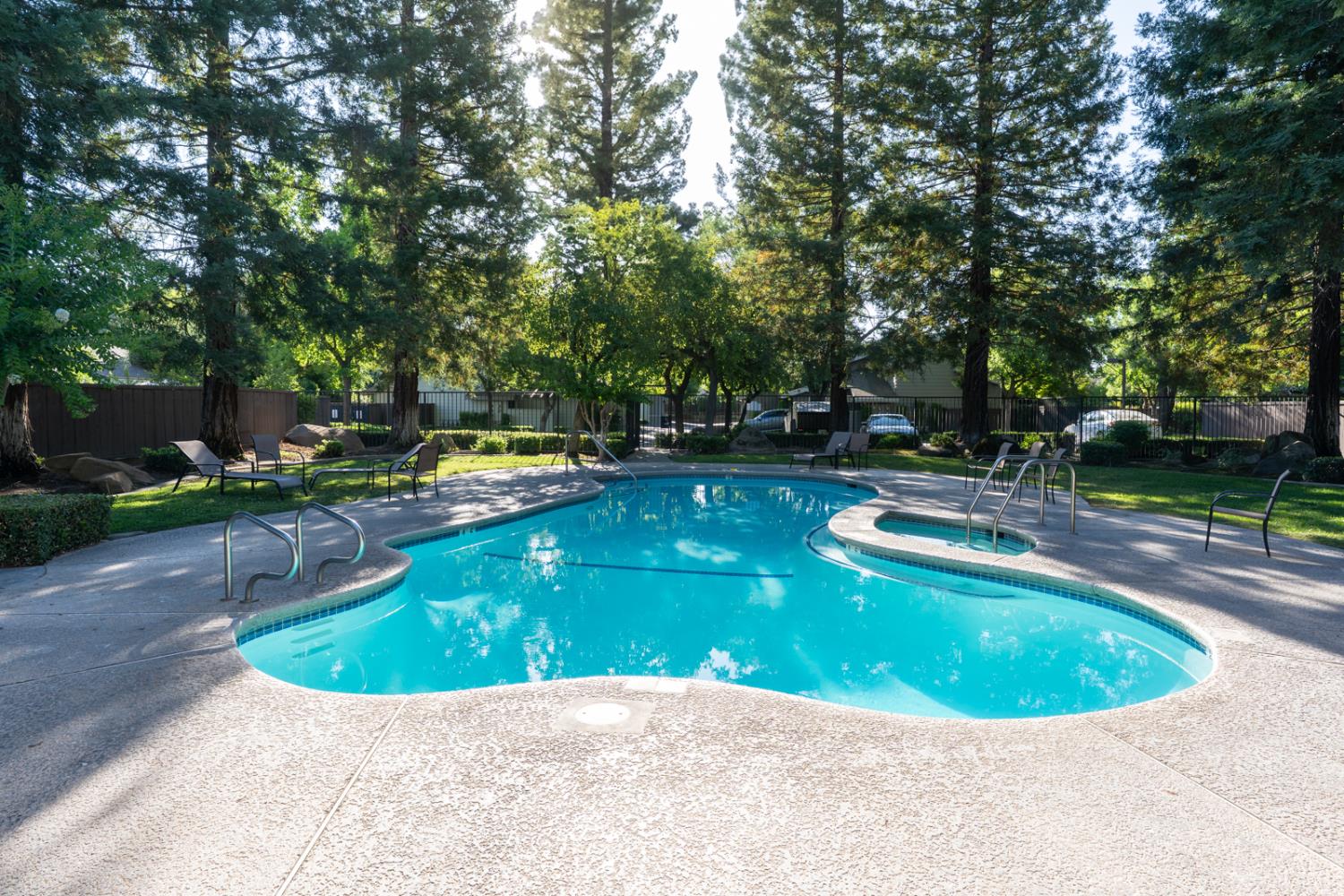 3350 M Street, Unit 74 Merced, CA 95348 - Photo 51 of 53 a view of a swimming pool with a sitting area