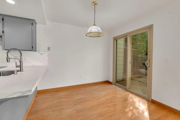 a view of a kitchen with a sink and dishwasher