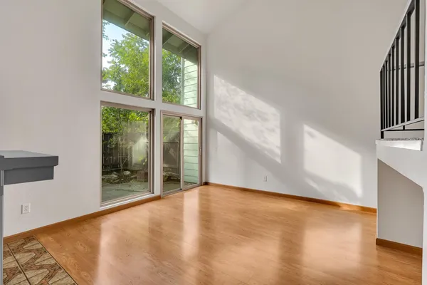 a view of a room with wooden floor and cabinet