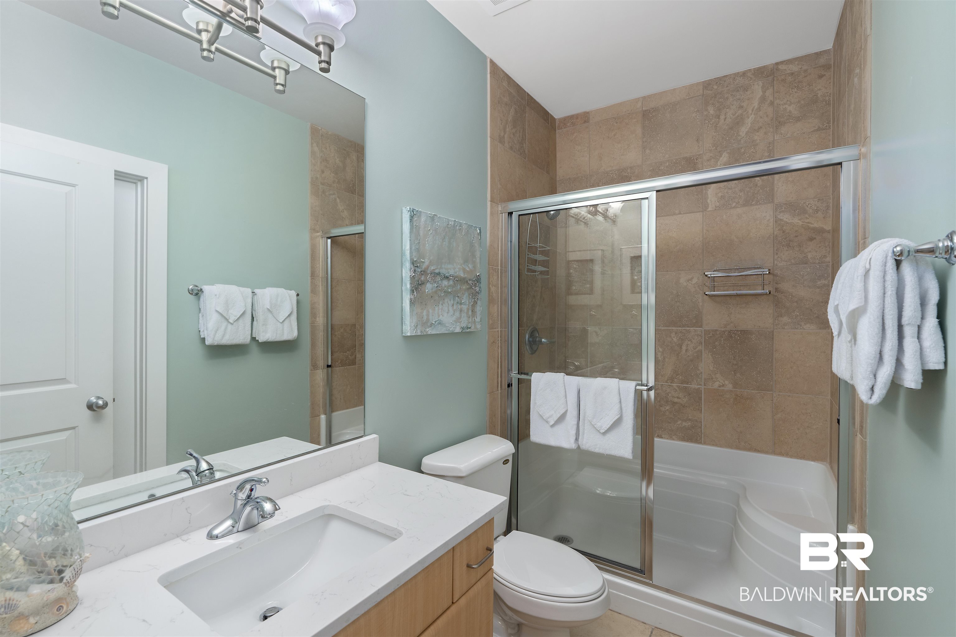 28107 Perdido Beach Boulevard, Unit DPH06 Orange Beach, AL 36561 - Photo 18 of 70 Bathroom with toilet, vanity, walk in shower, and tile patterned floors