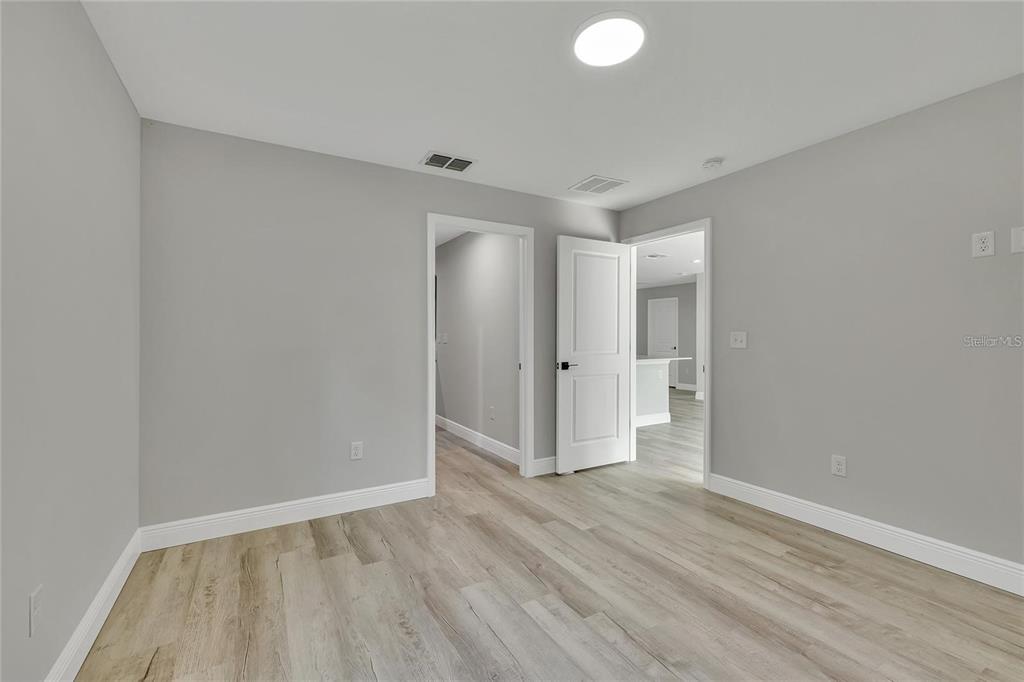 68 Water Track Loop Ocala, FL 34472 - Photo 12 of 20 a view of an empty room and wooden floor