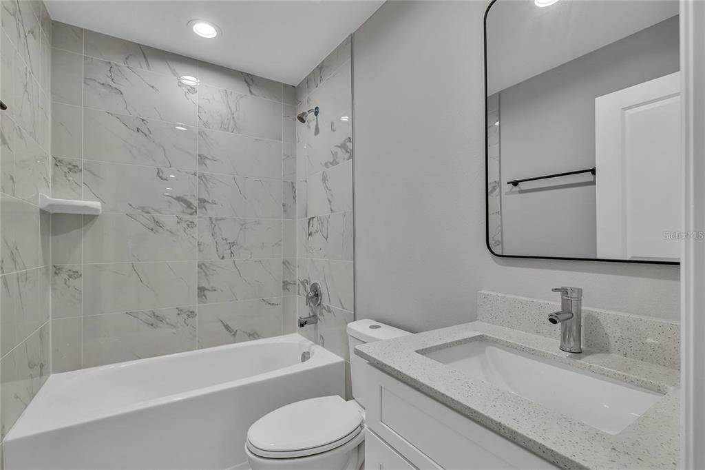 68 Water Track Loop Ocala, FL 34472 - Photo 15 of 20 a bathroom with a granite countertop sink toilet and shower