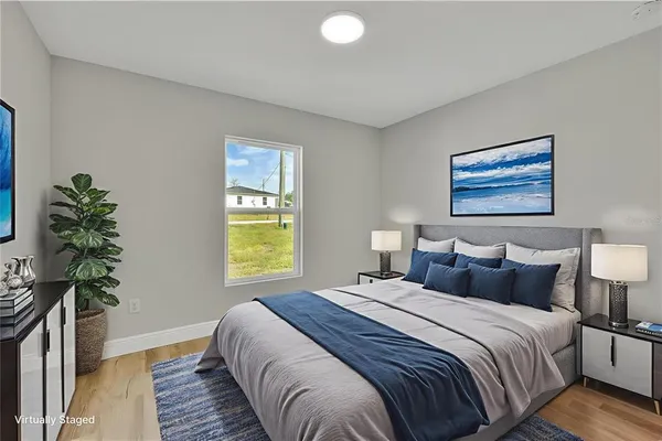 a bedroom with bed and a window