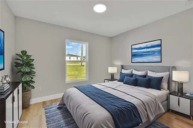 a bedroom with bed and a window