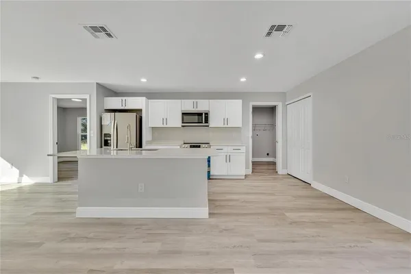 a view of kitchen with wooden floor