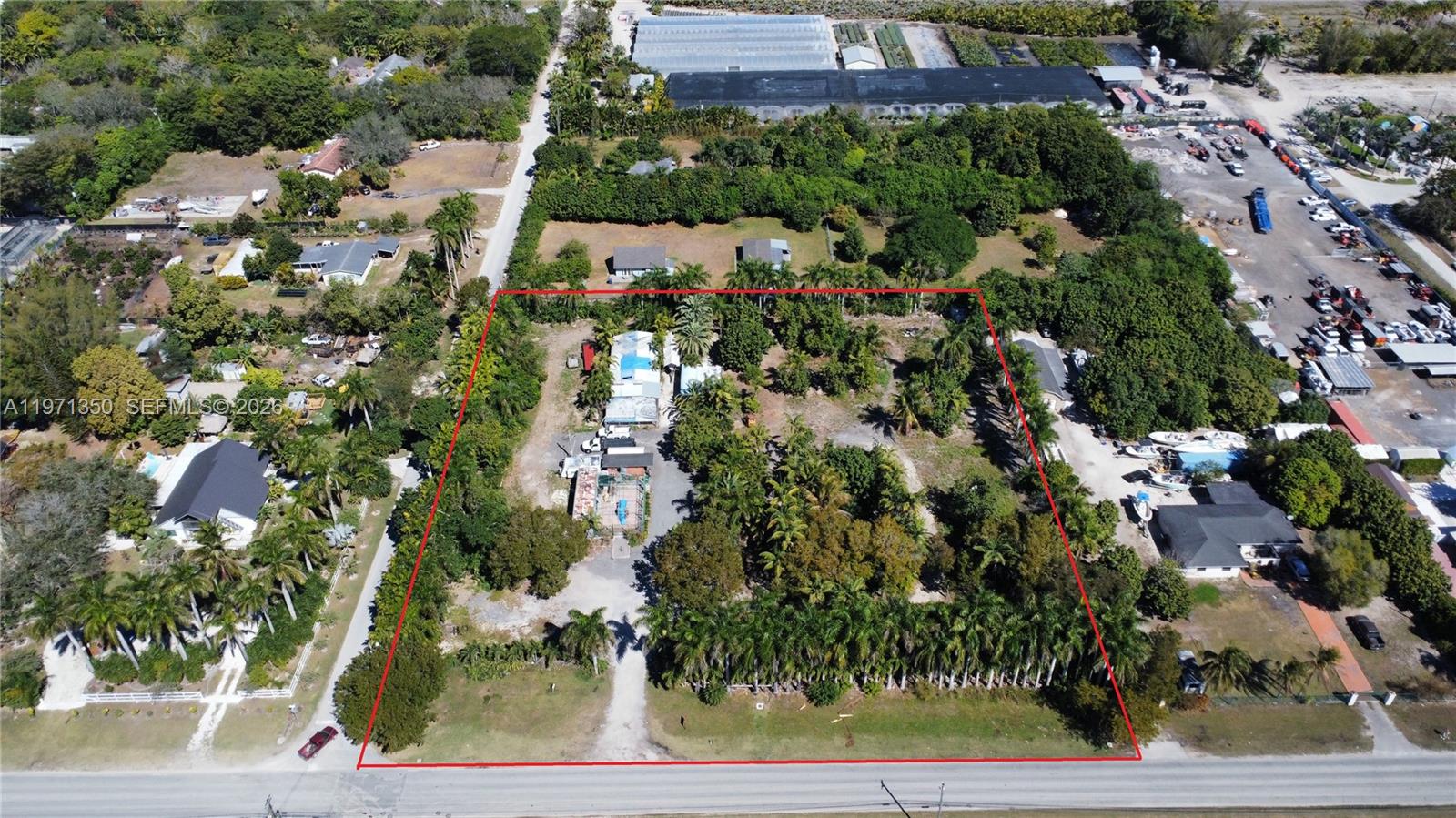 19355 Southwest 320th Street Homestead, FL 33030 - Photo 1 of 10 an aerial view of multiple house