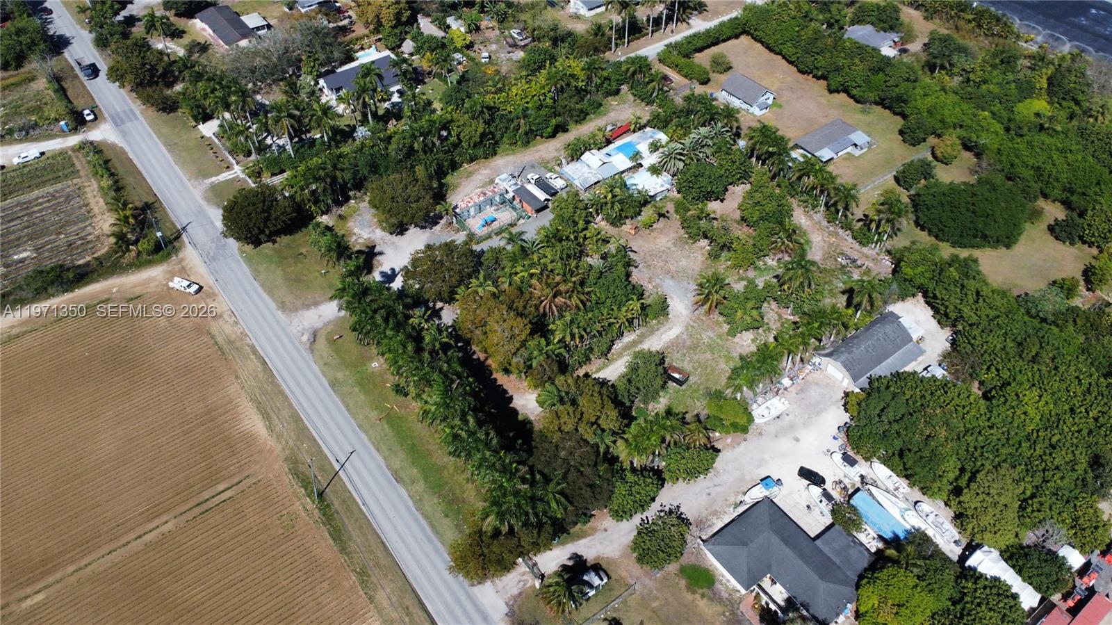 19355 Southwest 320th Street Homestead, FL 33030 - Photo 4 of 10 an aerial view of a house with a yard