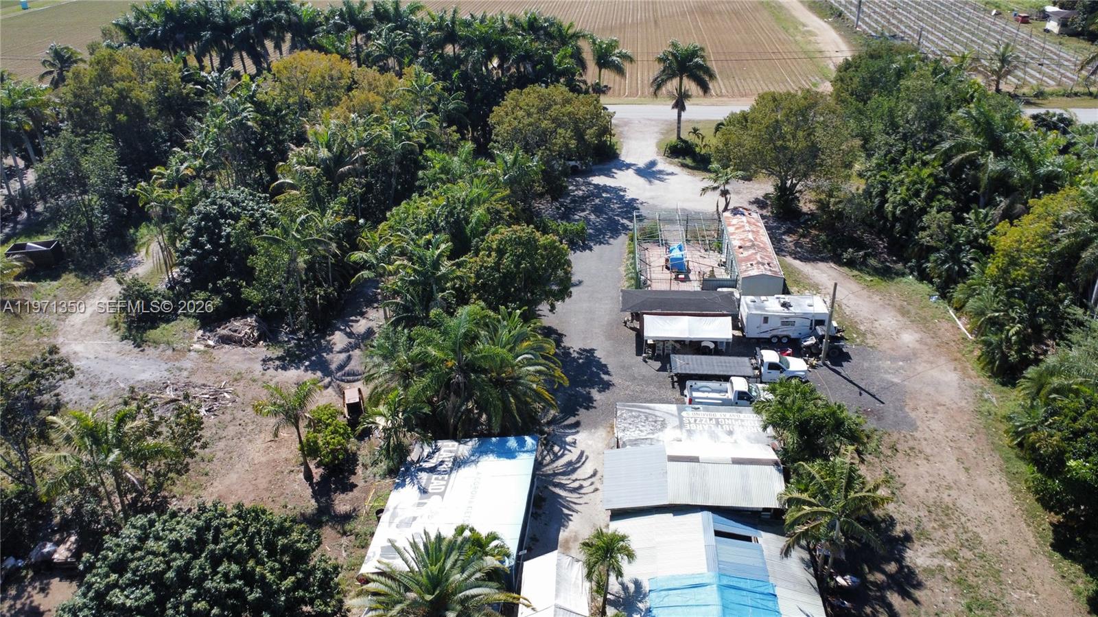 19355 Southwest 320th Street Homestead, FL 33030 - Photo 10 of 10 an aerial view of multiple houses with yard