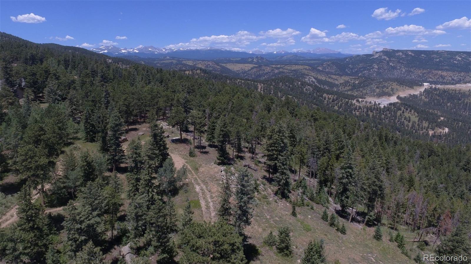 93 Gross Dam Road Golden, CO 80403 - Photo 12 of 35 a view of a city in the middle of a yard