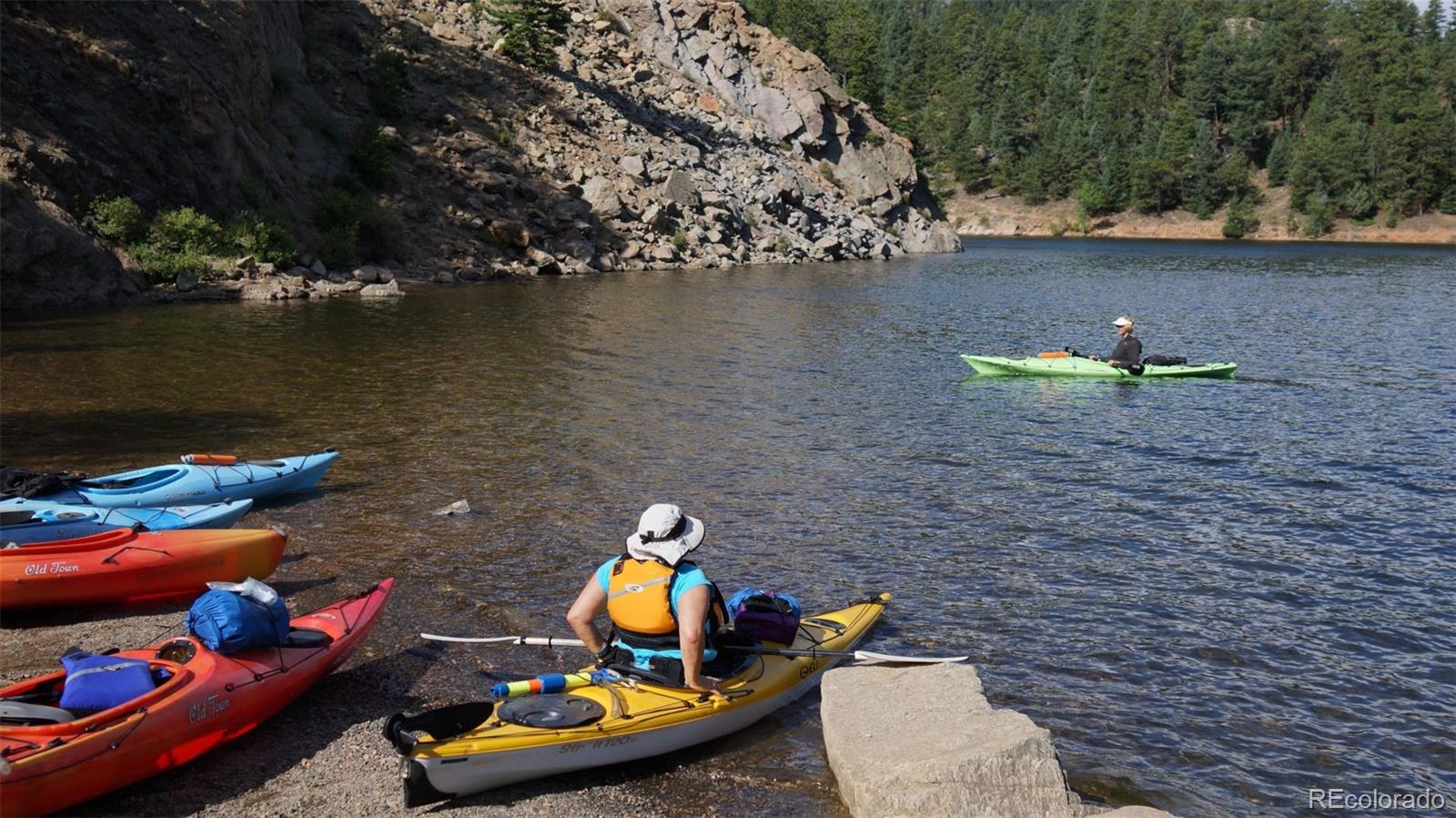 93 Gross Dam Road Golden, CO 80403 - Photo 27 of 35 a view of a lake with outdoor seating