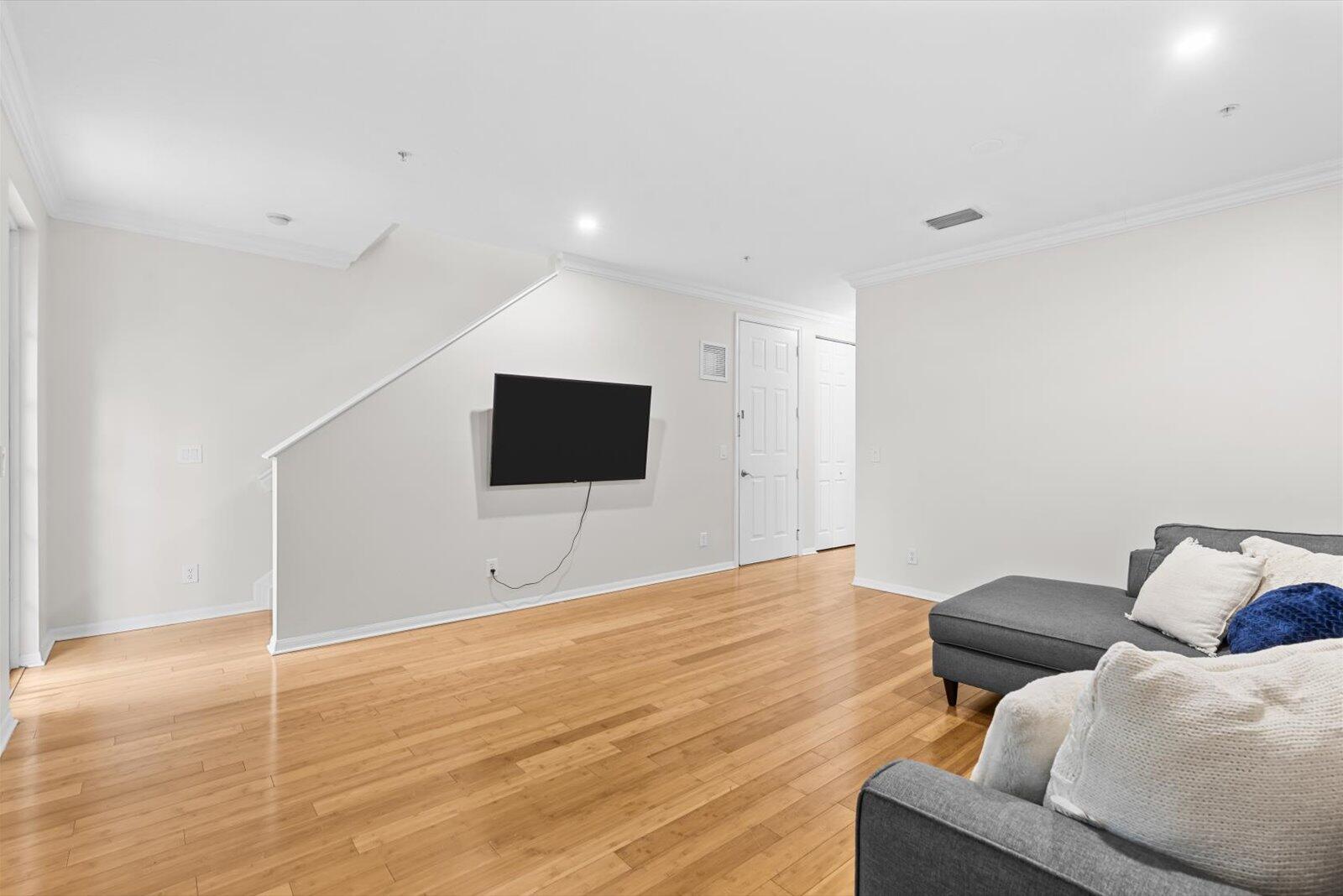 1460 Corbison Point Place Jupiter, FL 33458 - Photo 13 of 85 a living room with furniture and a flat screen tv