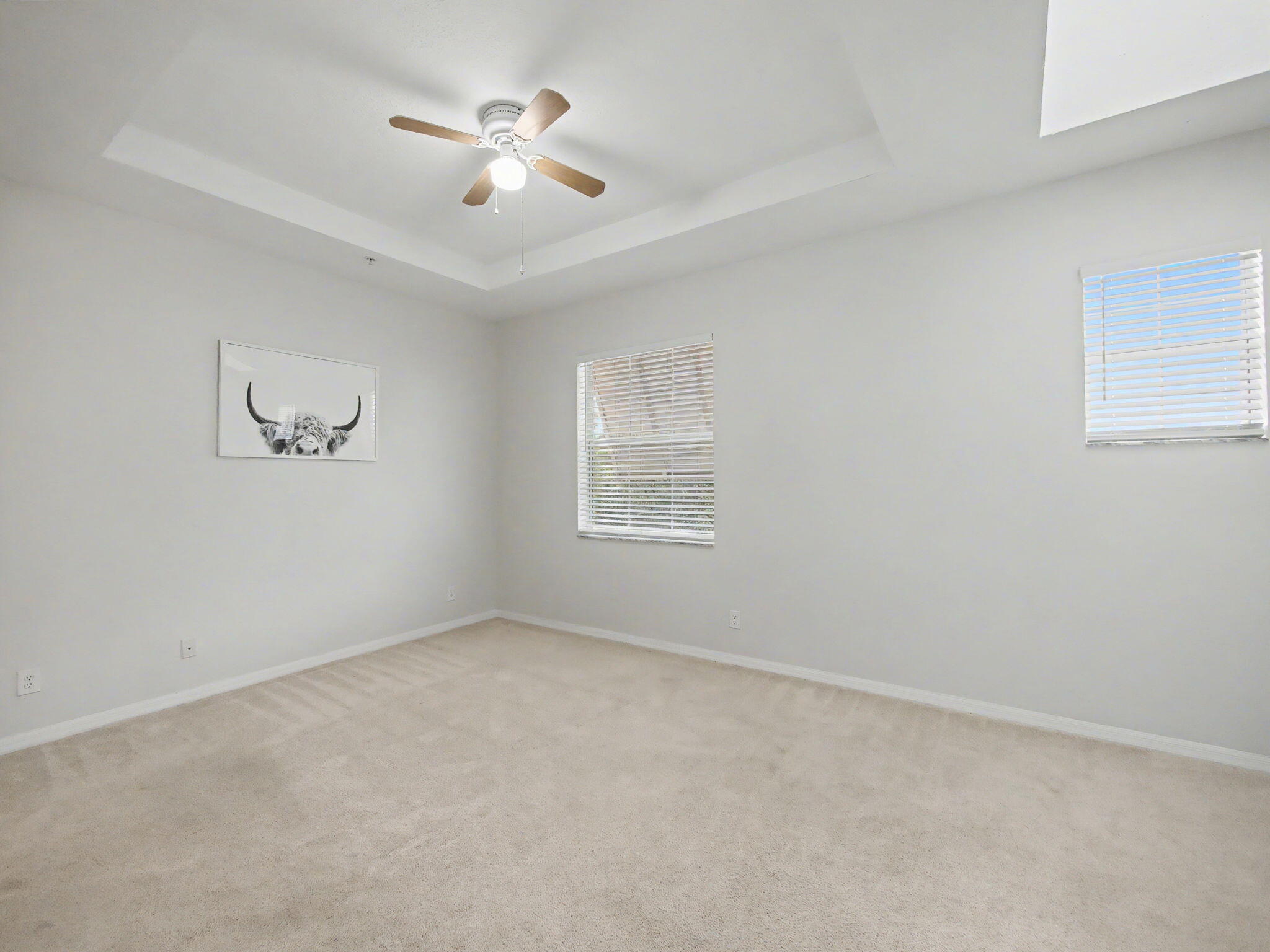 1460 Corbison Point Place Jupiter, FL 33458 - Photo 16 of 85 an empty room with a window and a ceiling fan