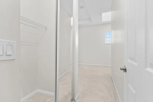 a bathroom with a sink toilet and a mirror