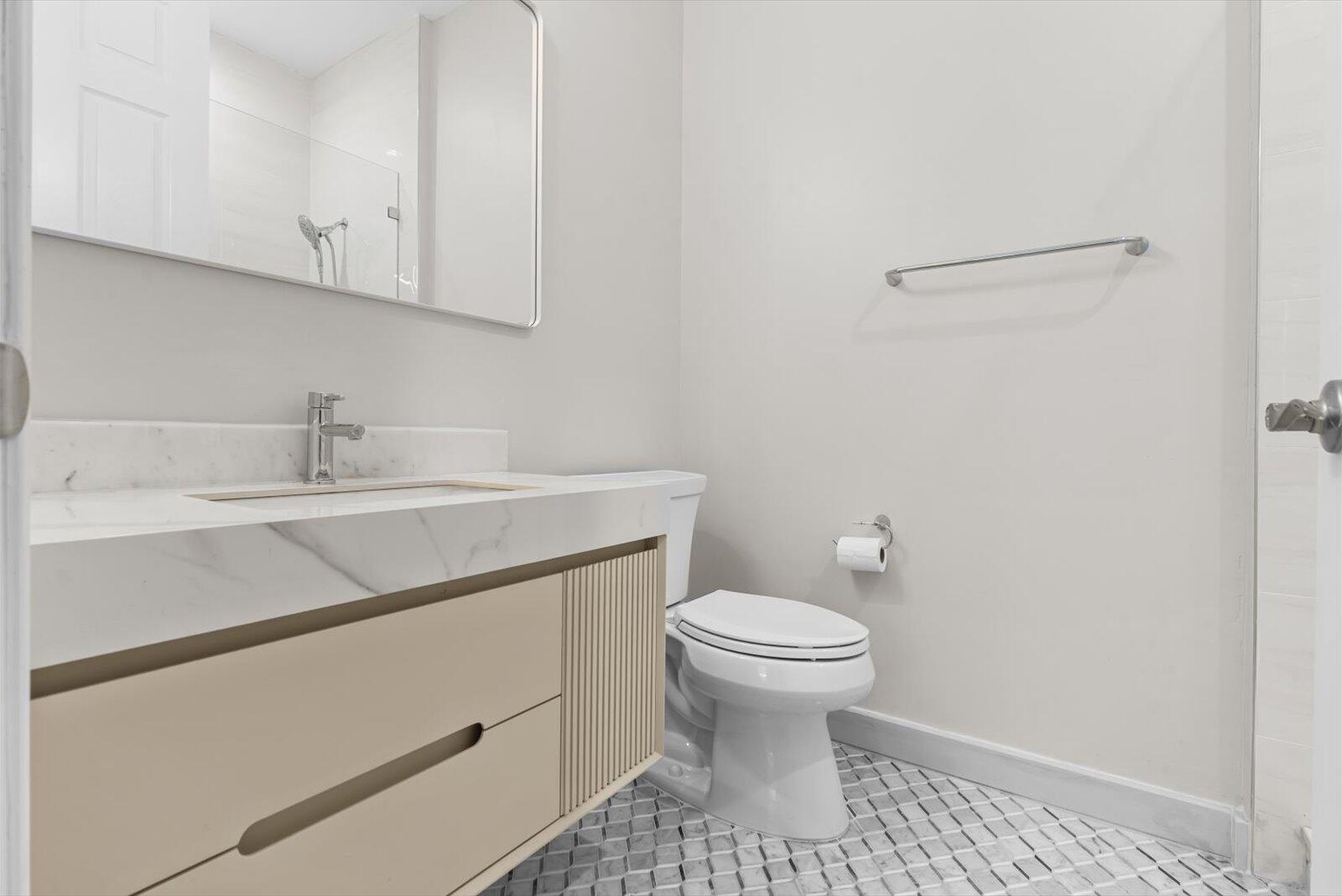 1460 Corbison Point Place Jupiter, FL 33458 - Photo 23 of 85 a bathroom with a sink toilet and vanity