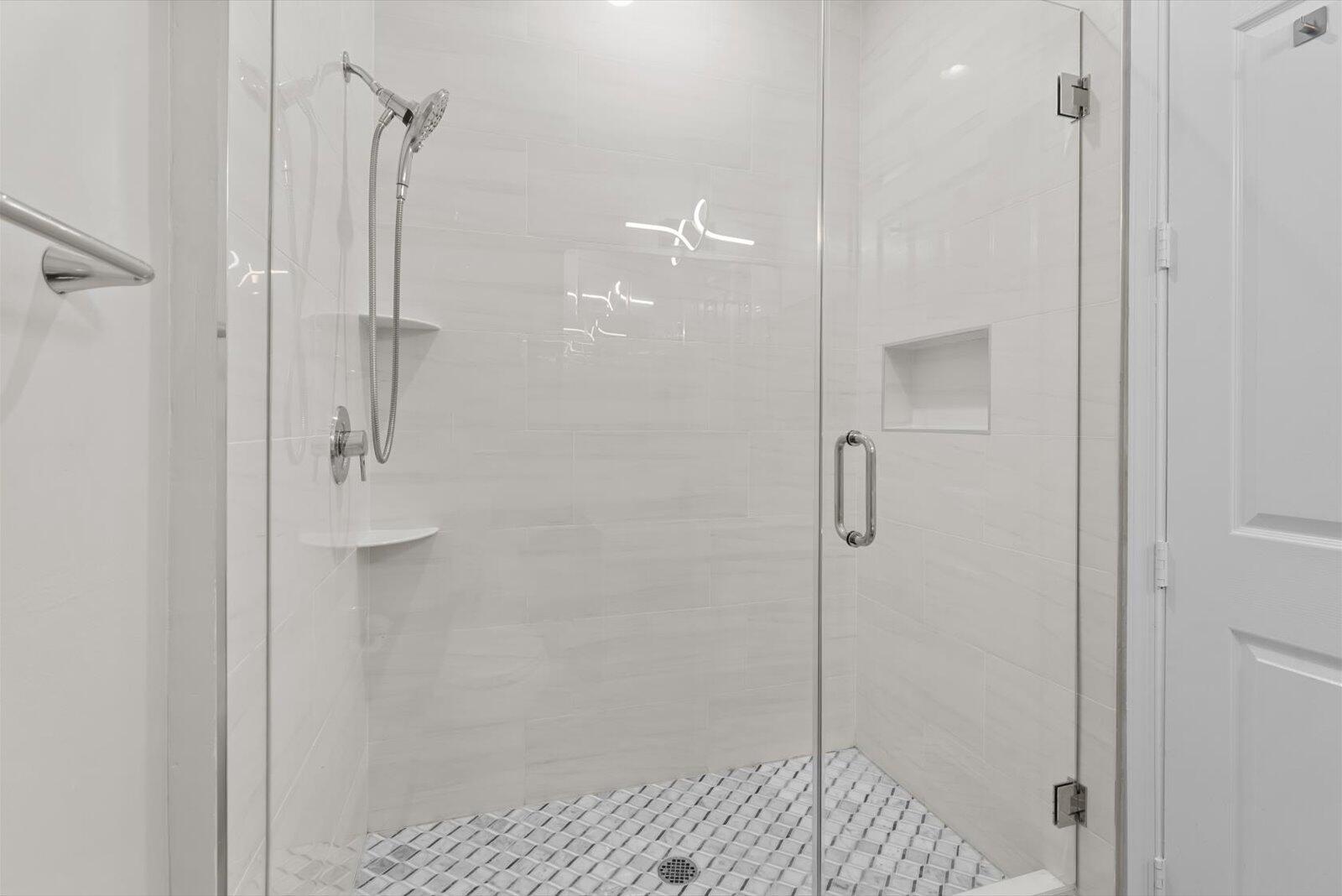1460 Corbison Point Place Jupiter, FL 33458 - Photo 25 of 85 a bathroom with a shower