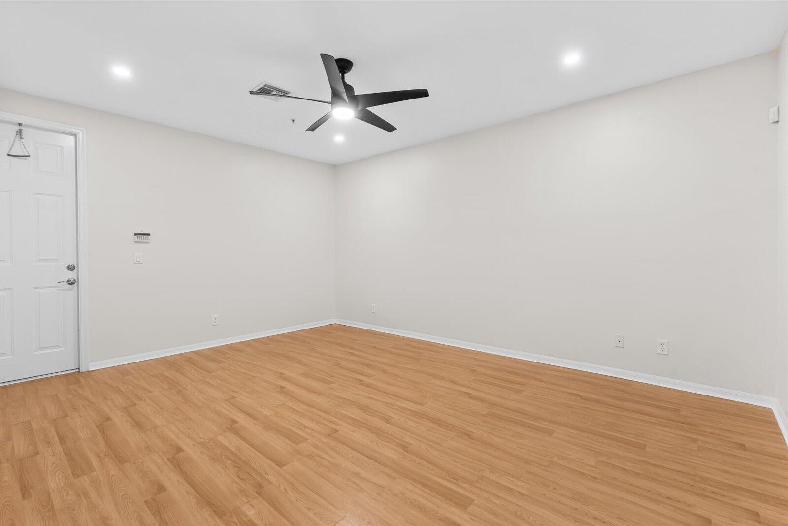 1460 Corbison Point Place Jupiter, FL 33458 - Photo 27 of 85 a view of a big room with wooden floor closet and windows