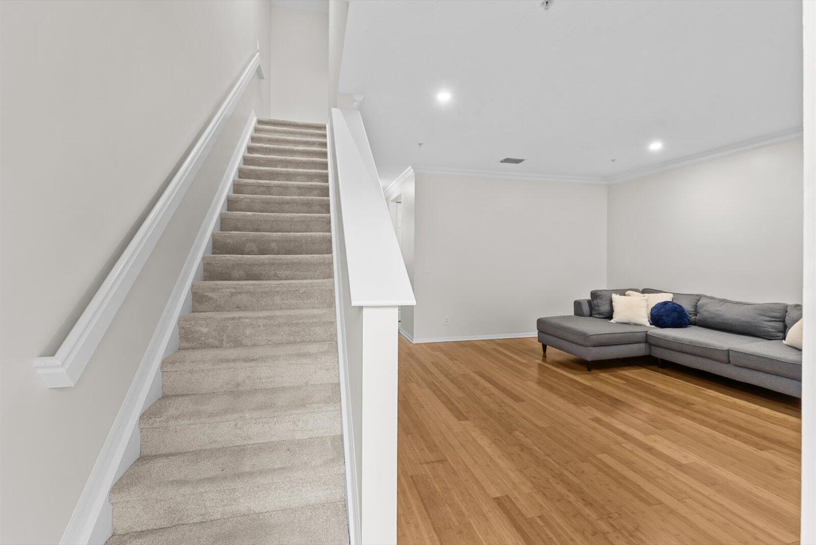 1460 Corbison Point Place Jupiter, FL 33458 - Photo 39 of 85 a living room with furniture and stairs