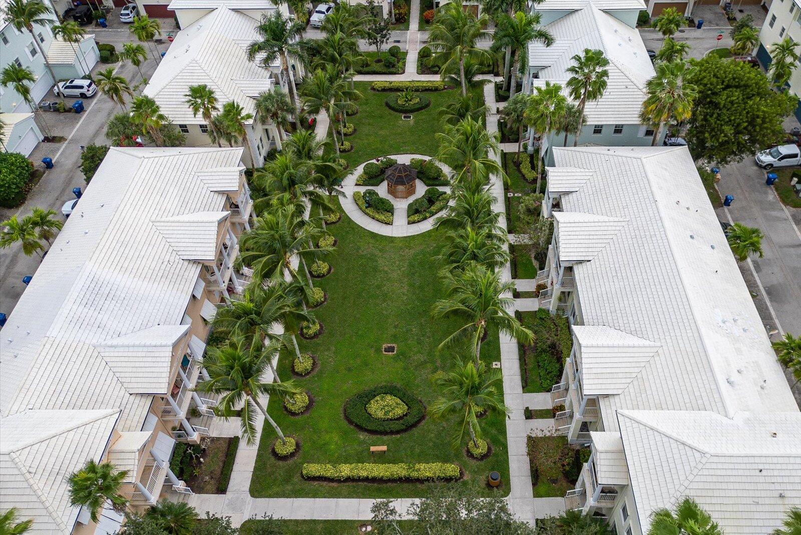 1460 Corbison Point Place Jupiter, FL 33458 - Photo 64 of 85 an aerial view of a residential houses with yard