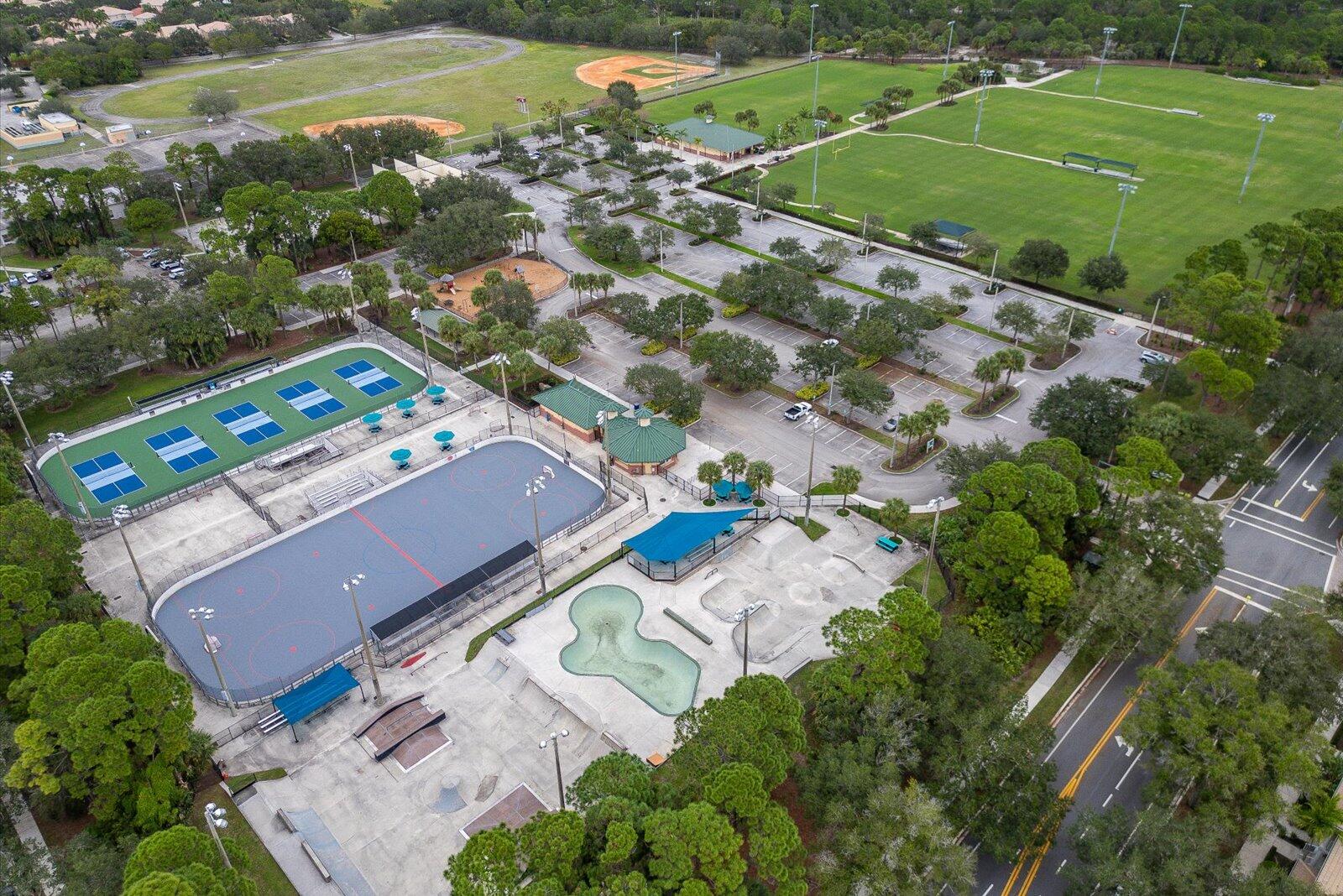 1460 Corbison Point Place Jupiter, FL 33458 - Photo 70 of 85 an aerial view of a house with a garden
