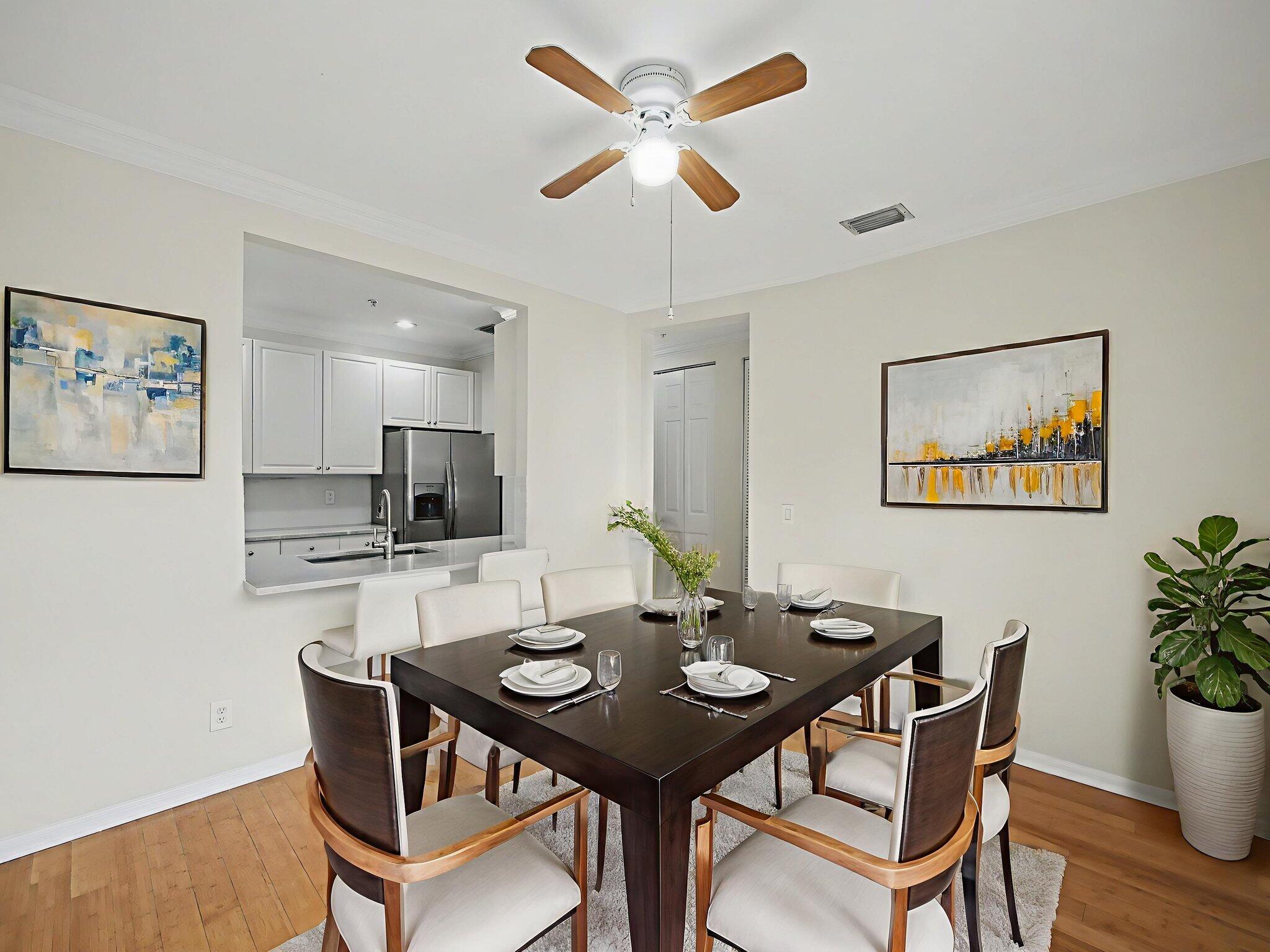 1460 Corbison Point Place Jupiter, FL 33458 - Photo 8 of 85 a view of a dining room with furniture and wooden floor