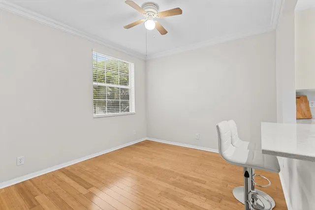a bathroom with a sink toilet and window