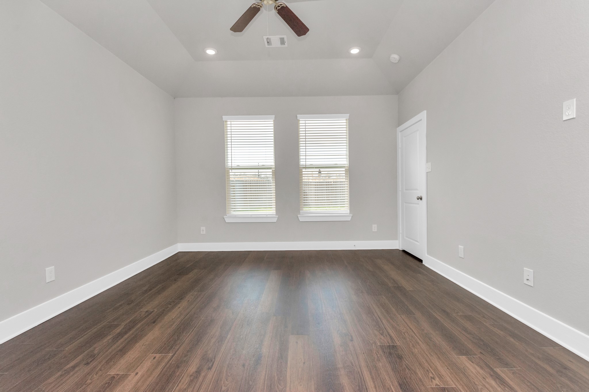 10502 Moon Valley Lane Rosharon, TX 77583 - Photo 8 of 23 an empty room with wooden floor and windows
