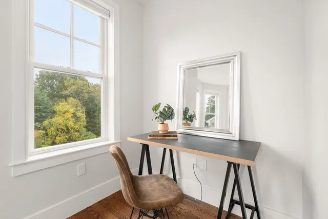 a dining room with furniture and window