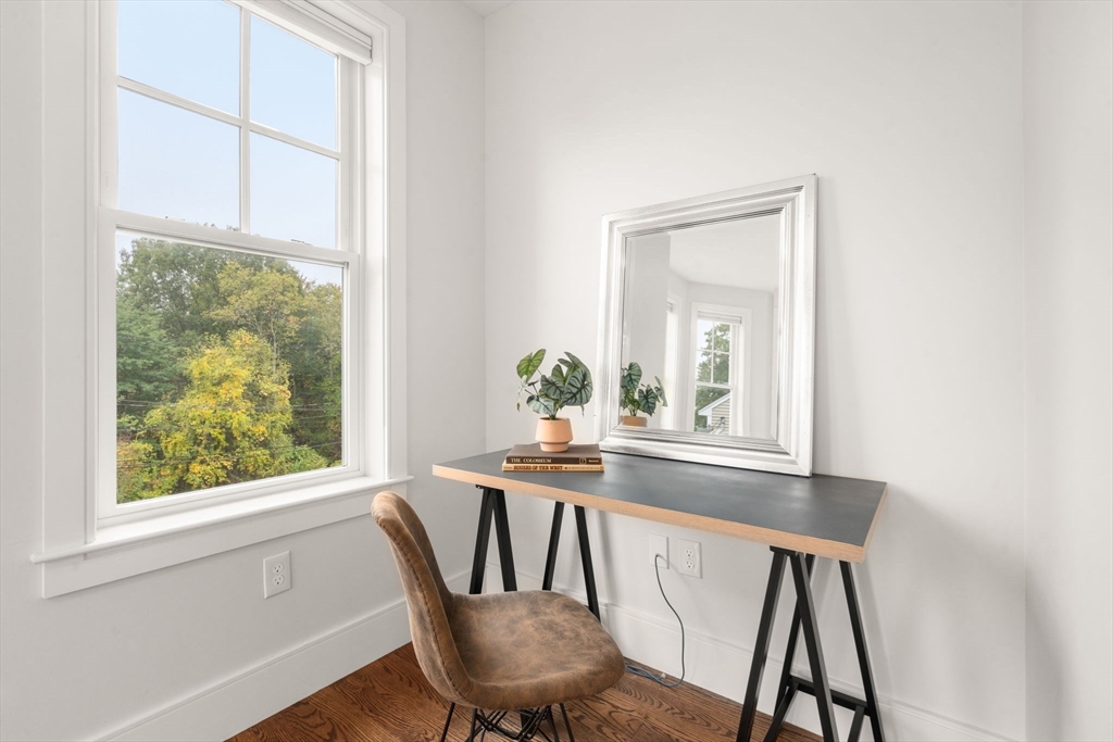 577 Baker Street, Unit 577 Boston, MA 02132 - Photo 15 of 22 a dining room with furniture and window