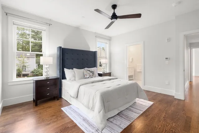a bedroom with a large bed and a window