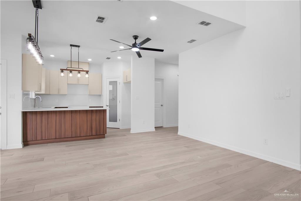2310 Corales Street Mission, TX 78573 - Photo 5 of 23 a view of a kitchen with a sink and cabinet area