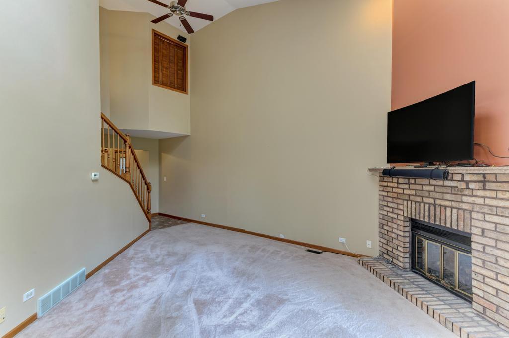 1753 Pebble Beach Drive Hoffman Estates, IL 60169 - Photo 5 of 35 a view of livingroom with furniture and a fireplace